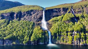 a waterfall on the side of a mountain at Krokstrand Fjellpark AS in Storforshei +31 photos