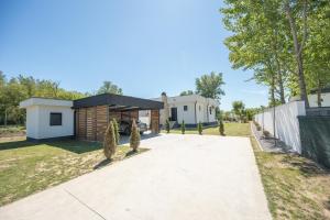 a house with a garage and a driveway at Drina Lux in Loznica