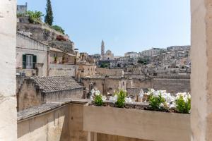 a view of a city from a balcony at 360 view of the Sassi in Matera