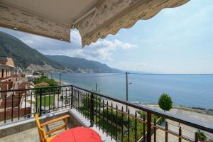 a balcony with a view of the water at Pharos Rooms in Ilia