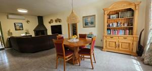 a living room with a table and a couch at Casa Rural Villa Arcadia in Corvera