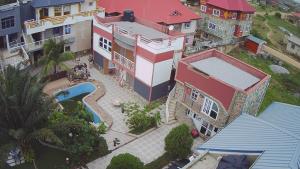an overhead view of a house with a swimming pool at Immanuel Victory hotel in Atebubu +5 photos