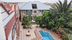 an aerial view of a house with a swimming pool at Immanuel Victory hotel in Atebubu