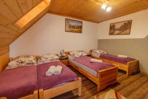 a room with three beds in a room at DW u Rafała i Joanny in Białka Tatrzańska +27 photos