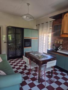 a kitchen with a ping pong table in a room at KolymBeddra in Agrigento +15 photos