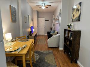 a living room with a table and a dining room at Jefferson Carriage House Hideaway in Huntington