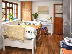 a dining room with a table and chairs at Little Hog Cottage in Seaton
