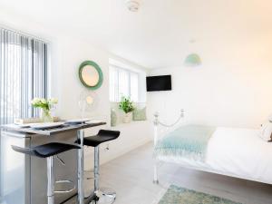 a bedroom with a bed and a desk and a bed at Meadow View-Uk34416 in Cheddar