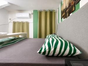 a bedroom with a bed with a pillow on it at Milano Brenta Suites Room for 2 in Milan