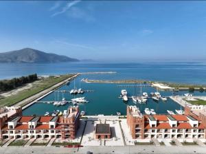 a view of a marina with boats in the water at BRAHIMAJ Appartament in Orikum