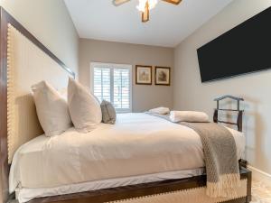 a bedroom with a large bed with white pillows at Royal Dornoch - Ukc6918 in Turnberry