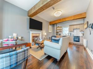 a living room with a couch and a table at Royal Dornoch - Ukc6918 in Turnberry