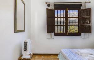 a room with a bed and a window at Casa Rural La Albahaca in Jimera de Líbar +8 photos