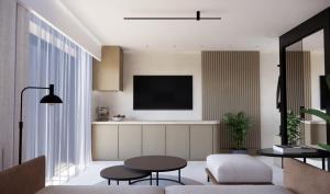 a living room with a tv and a table at Nerion Hotel & Spa in Agia Marina Nea Kydonias +10 photos
