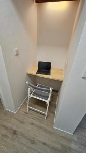 a laptop computer sitting on a desk in a room at Schönes Apartment in Verl in Verl