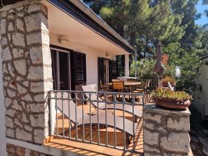 a balcony of a house with a fence at Villa Mala in Zavala