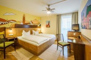 Postel nebo postele na pokoji v ubytování Hotel Brunner