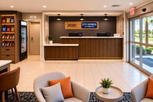 a lobby of a hotel with a waiting room at City Express by Marriott Lafayette in Lafayette