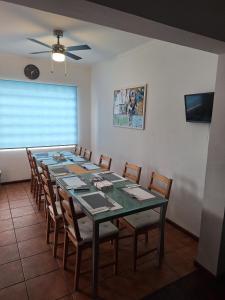 a conference room with a long table and chairs at Adamas Bed & Breakfast in Ponta Delgada