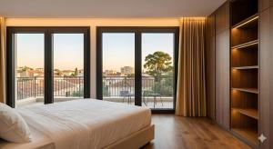 a bedroom with a bed and a large window at Golden Hill Villas Phu Quoc in Phú Quốc