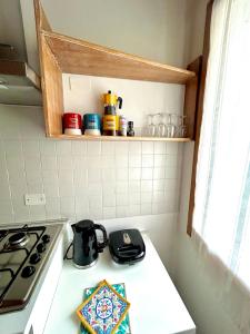 a kitchen with a stove and a stove top oven at Ca' Luciana Valdobbiadene in Valdobbiadene
