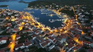 an aerial view of a harbor at night at Vecky in Jezera +7 photos