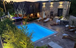 a swimming pool in the middle of a yard at Luxurious Home In Biorine in Biorine +41 photos
