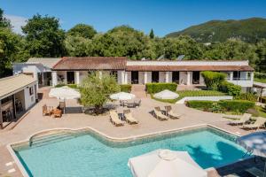 an overhead view of a pool with chairs and umbrellas at Summer Nights Resort in Ipsos