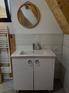 a bathroom with a sink and a mirror at Vlasic Odmor - Villa Ajla in Vlasic +40 photos