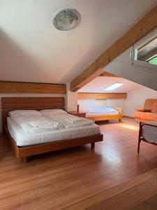 a bedroom with a bed and an attic at Al Montel - Tre faggi in Borgo