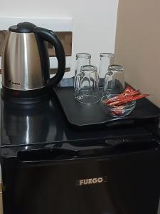 a coffee pot sitting on top of a stove at Sofija apartments in Gevgelija