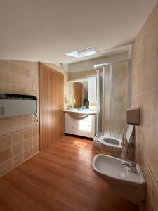 a bathroom with a sink and a toilet at Al Montel - Tre faggi in Borgo