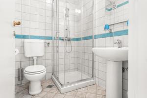 a bathroom with a toilet and a shower and a sink at Villa Lili in Lovran +15 photos