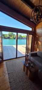 a living room with a view of a large glass door at Sunshine House Ada Bojana in Ulcinj