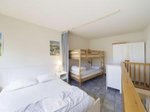 a bedroom with a bed and a bunk bed at Appartement avec mezzanine pour 4, vue sur Gourette - FR-1-400-49 in Gourette