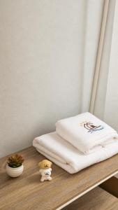 a bed sitting on a table with a towel at OneVillaResort in Ban Son Tap Tao +23 photos