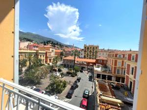a view of a city from a balcony at VERLAINE House in Menton