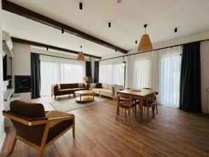a living room with a couch and a table at Eco villa in Quba