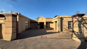 a house with a driveway in front of it at Guesthouse 116 on McLean in Welkom