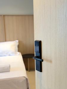 a close up of a door in a hotel room at RAI Rooms Saranda in Sarandë +21 photos