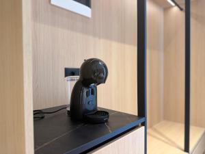 a black helmet sitting on top of a counter at RAI Rooms Saranda in Sarandë