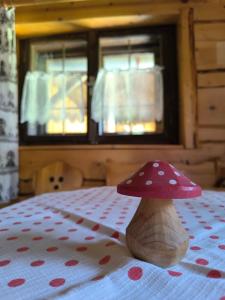 a pair of mushrooms sitting on top of a bed at Privát Evi 166 in Nižná Boca