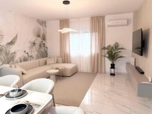 a living room with a couch and a table at Luxury Villa Rubi Vir - private pool in Vir
