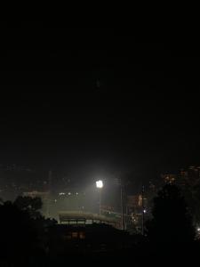 a night view of a city with a street light at The 1802 travellers inn in Shillong