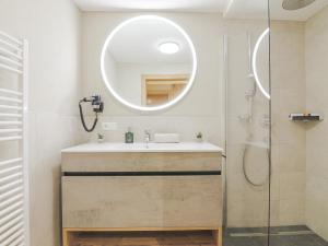 a bathroom with a sink and a mirror at Apartment Gerlos 183 in Gerlos