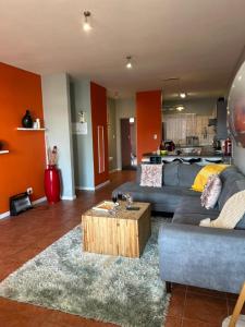 a living room with two couches and a coffee table at Beach Hive 2 in Walvis Bay