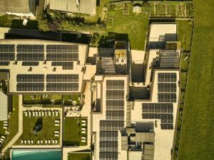 an overhead view of a building with solar panels at Hirben Naturlaub in Villabassa +163 photos