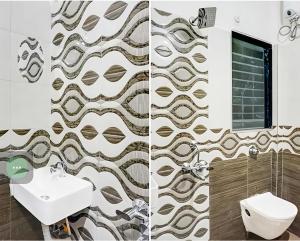 a bathroom with a sink and a toilet at Hotel sai laxmi residency in Lonavala