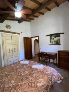 a bedroom with a large bed with a ceiling at Eclissi casa vacanza SOLE in Casalini