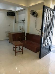 a room with a couch and a table and a door at City Hotel in Luxor